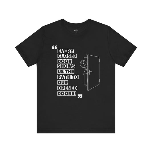 "Closed Doors Open New Paths" – Unisex Jersey Tee