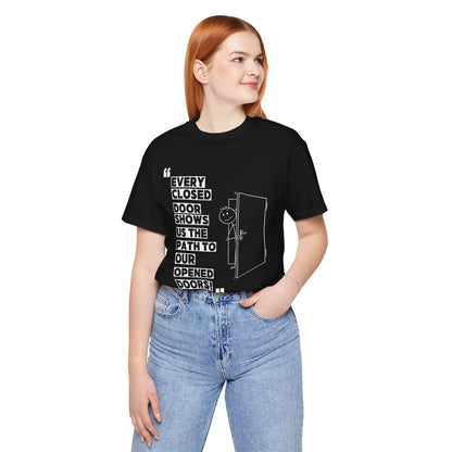 "Closed Doors Open New Paths" – Unisex Jersey Tee