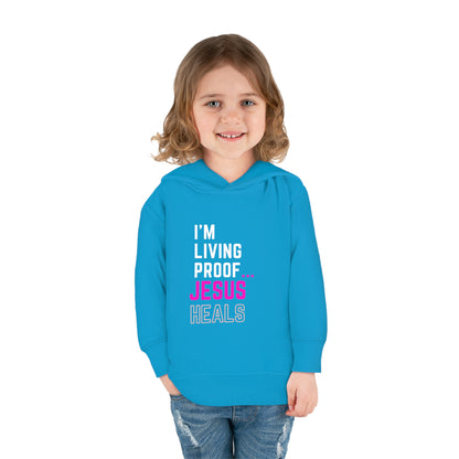 I'm living proof...Jesus Heals- Toddler Pullover Hoodie (pink letters)