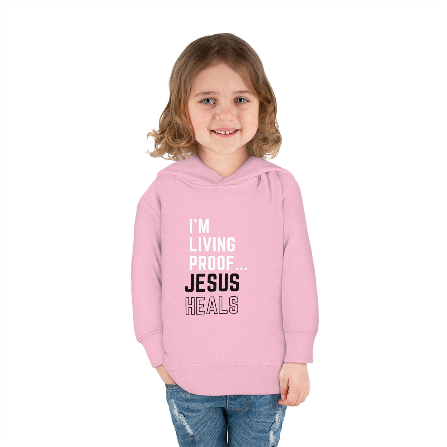 I'm living proof...Jesus Heals- Toddler Pullover Hoodie (pink letters)